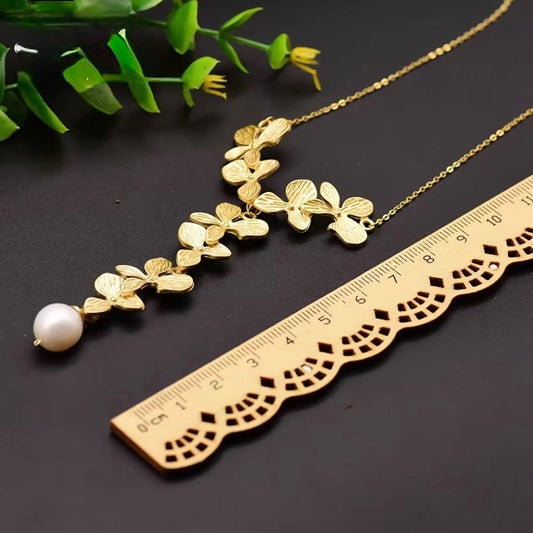 Natural  Pearl Sweater Necklace — a custom, handmade vintage piece featuring an 18k gold-plated long chain within fine jewelry.