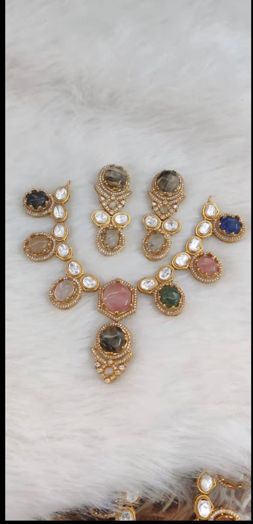 Gold kundan necklace and earring set with pink, green, blue and smoky gemstones"