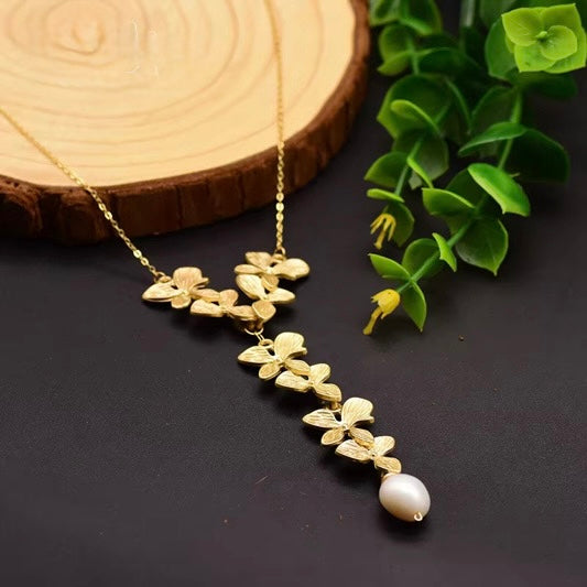 Natural  Pearl Sweater Necklace — a custom, handmade vintage piece featuring an 18k gold-plated long chain within fine jewelry.